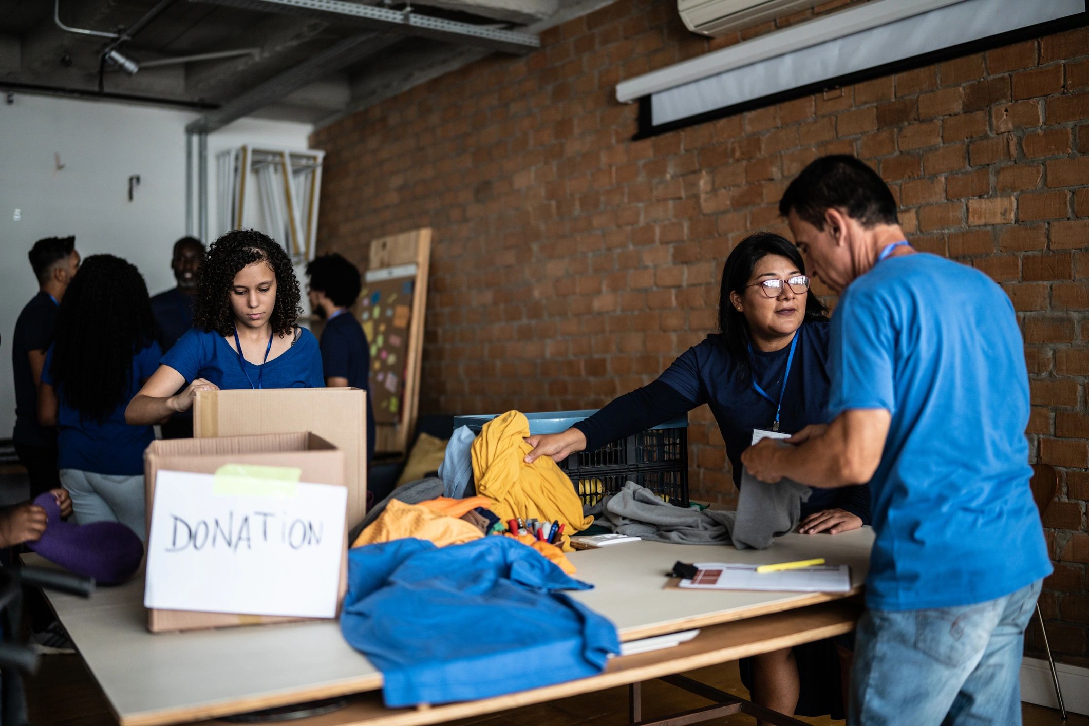 Volunteers sorting donated clothing