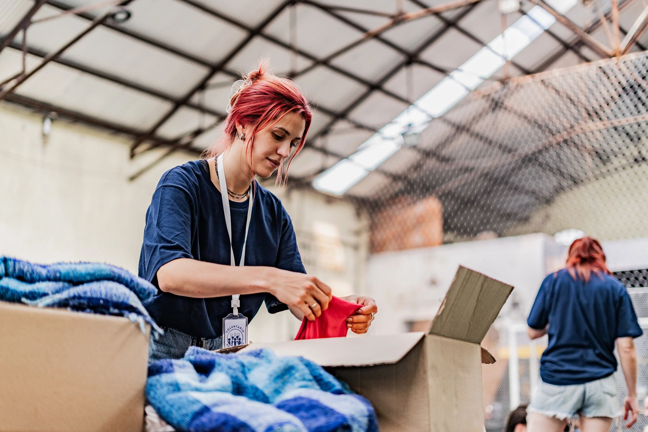 Volunteer sorting donated clothing
